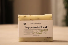 Load image into Gallery viewer, Peppermint Leaf hand and body soap bar on a stand. 5 oz., handcrafted, organic, vegan. Olive Seed
