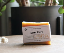 Load image into Gallery viewer, Acne soap on stand, handcrafted, organic, vegan soap made with neem oil to help clear acne and blemishes. Olive Seed
